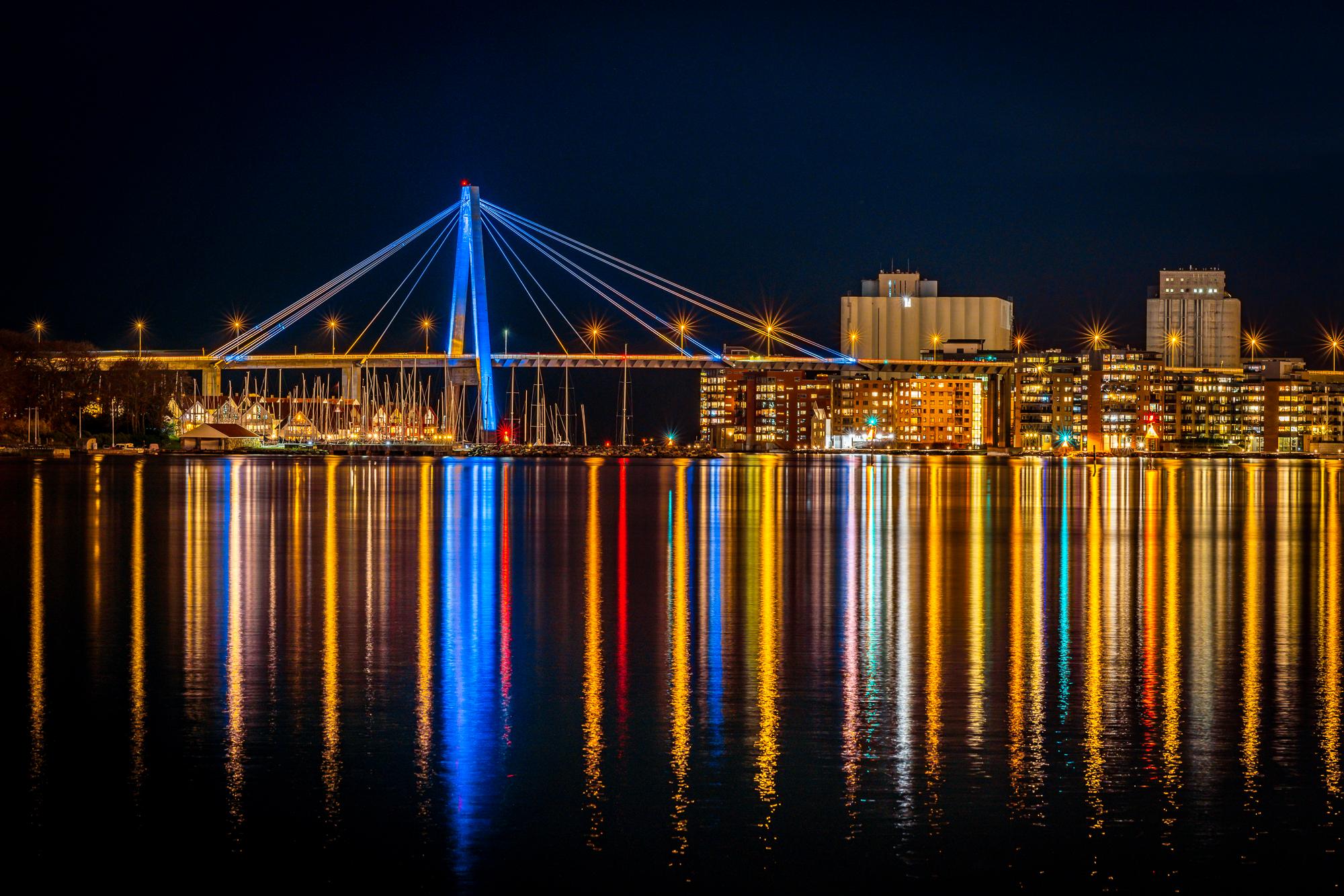 The Stavanger city bridge seen at night with lights and colours.